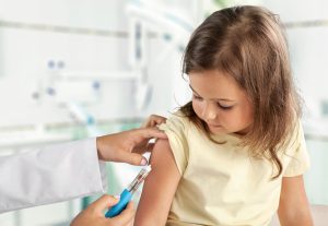 Little girl receiving a vaccination