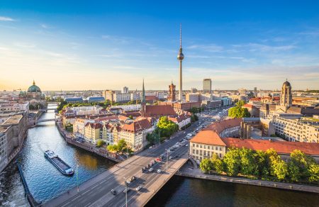 Berlin skyline panorama with TV tower and Spree river at sunset